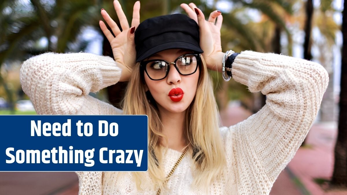 Close up portrait of pretty blonde woman wearing trendy casual outfit , red lipstick and clear glasses, manicure and jewelry, surprised emotions, posing on the street with palms, travel alone.