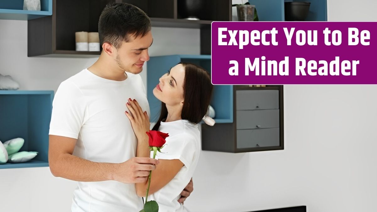 Man presenting red rose to girlfriend at home.