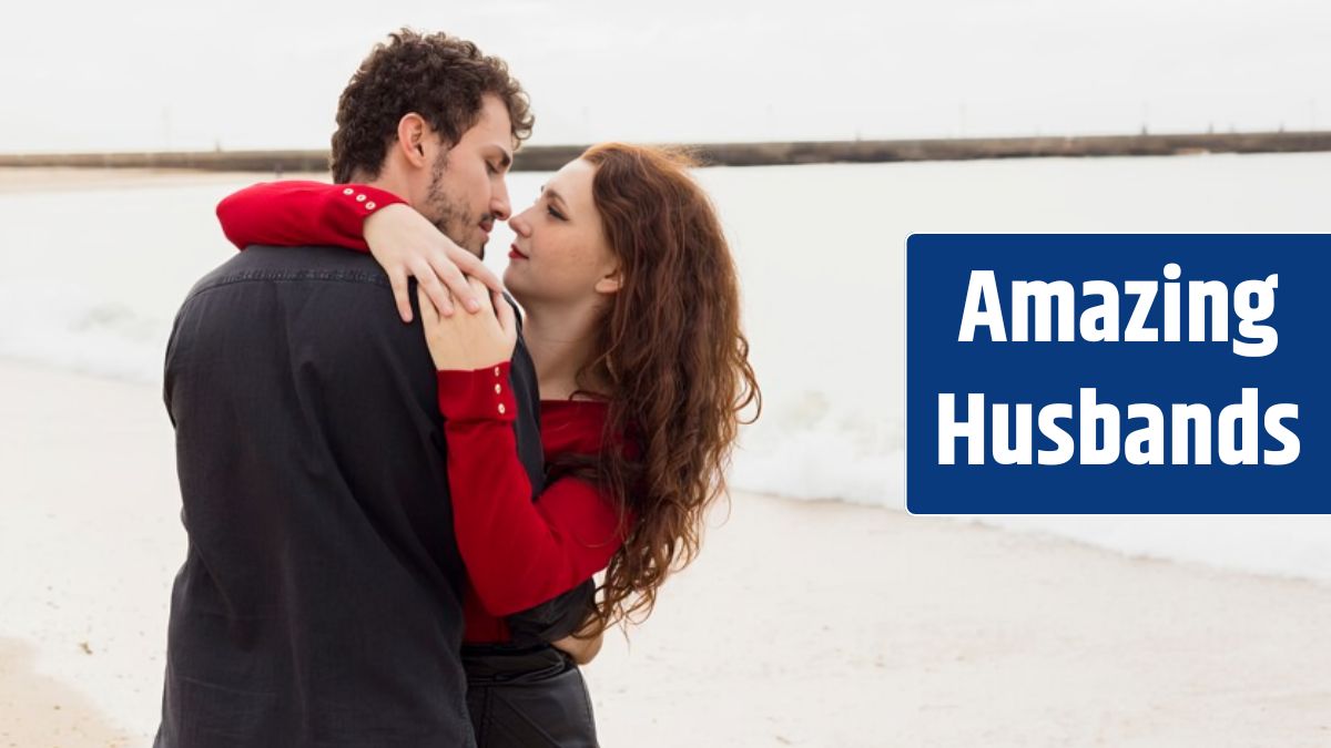 Young couple hugging on sea shore.